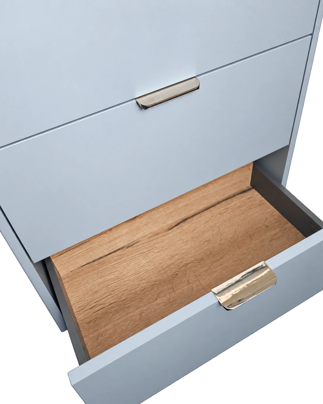 Close view of the sample vanity’s open bottom drawer and oak-effect interior